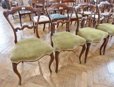 Set of four Victorian rosewood shaped-back dining chairs, each with shaped arched top rail, arched