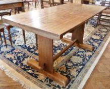 Oak refectory dining table, on angular end supports, sledge feet and cross stretcher, 52cm long