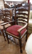 Set of six reproduction shaped ladderback rush-seated dining chairs, viz:- four standards and two