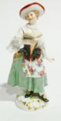 Meissen porcelain figure of lady singing and holding songbook wearing red and white bonnet, floral