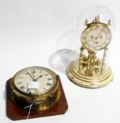 A circular brass mounted wall clock, Roman numeral dial with subsidiary seconds dial and a Kundo