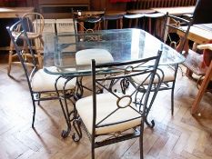 Conservatory metal and glass table and chairs, in mottled grey and gilt metal, the table with