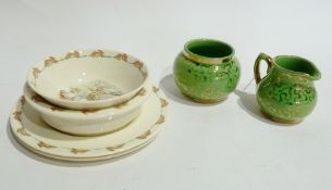 Four pieces Doulton Bunnikins pottery and a Sudlows Burslem gilt and green cream jug and sugar basin