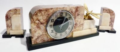 An Art Deco marble mantel clock with matching garniture set, with gilt model dragonfly attached (