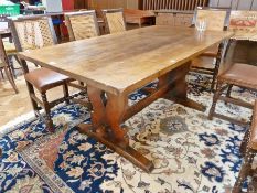 Oak refectory dining table, on shaped standard end supports and cross stretcher, 167cm long