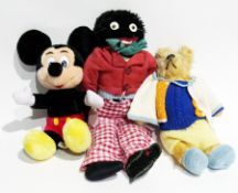 Gold plush bear with pointed snout, Disneyland Mickey and a black fabric golly with velvet face