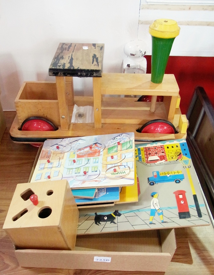 A large wooden child's train together with seven young child's puzzles