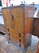 20th century walnut veneer cabinet, the pair of cupboard doors enclosing shelf, with three long