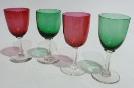 Seven cranberry bowl stem wine glasses, two cranberry small tumblers,set of six cranberry glass