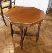 Victorian walnut occasional table, octagonal with pierced fret carved X-frame stretchers, with