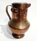 An Arts and Crafts style copper flagon baluster-shaped, with cover, handle, 29cm high approx.