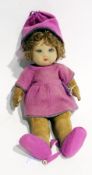 Chad Valley "Bambina" girl felt doll, with blue glass, having brown curly hair, pink felt hat, dress