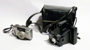 A Canon Z115 caption camera, printer, tripod, and other camera equipment (1 box)