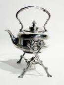 A silver plate kettle on stand, of circular reeded form, the stand of naturalistic branch form,