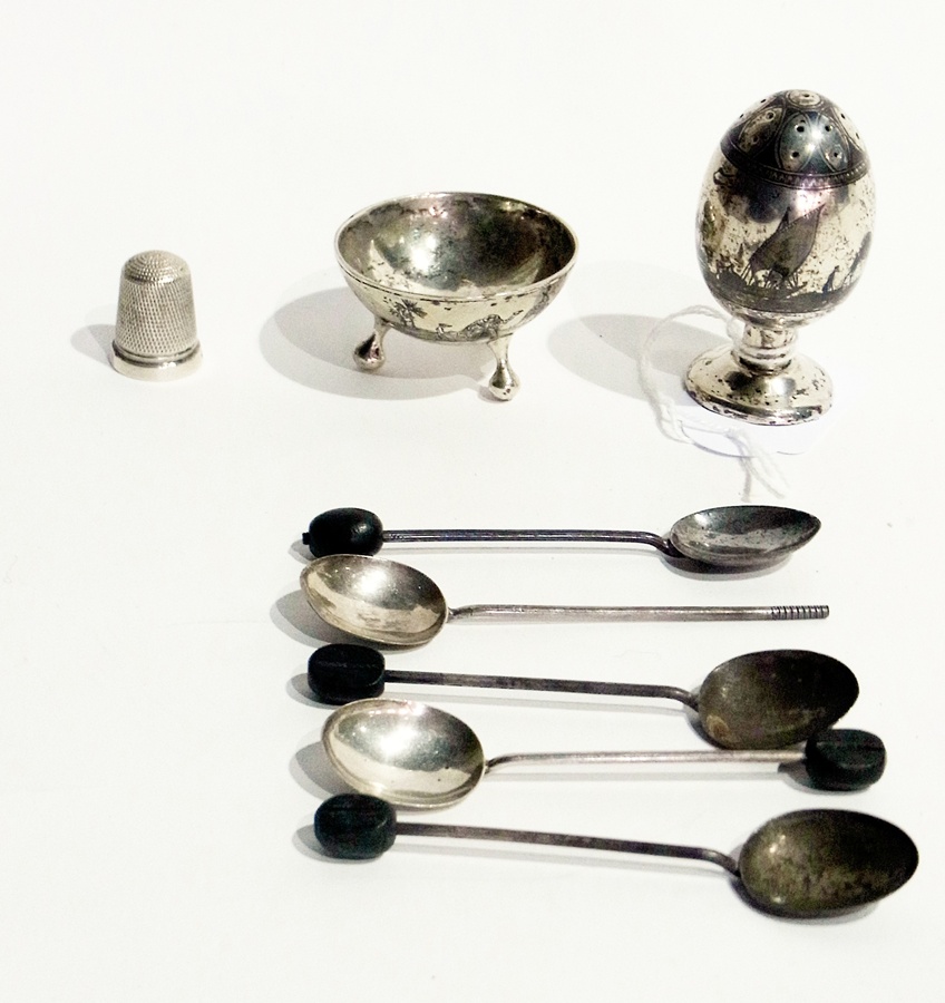 Egyptian white metal pepper pot and salt, five silver coffee bean spoons and a silver thimble