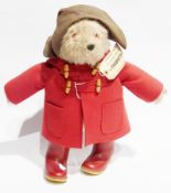 Paddington Bear wearing brown felt souwester and red duffel coat, label  inscribed "Please look