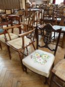 Edwardian inlaid mahogany open arm occasional chair having scroll top rail, pierced slender