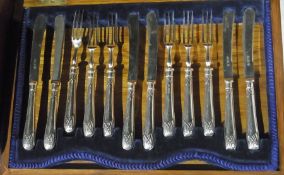 A set of six silver handled fruit knives and forks in fitted case, together with a set of six fish