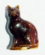19th century Staffordshire treacle glazed cat money box in the form of seated cat, 13cm high