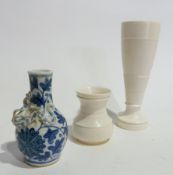 Carved and turned ivory vase with bands of reeded decoration and Chinese blue and white pottery