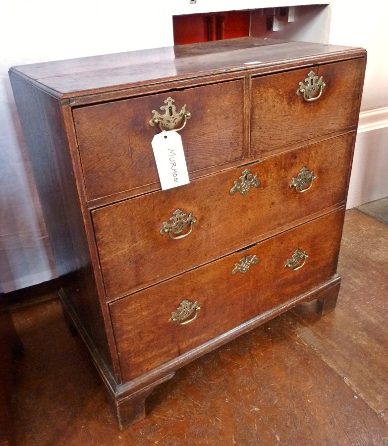 18th century oak caddy-top chest of two short and two long drawers with old brass pierced plate