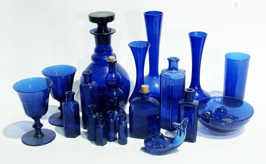 Quantity of blue glass to include:- decanter with stopper, three vases, medicine bottles, bowl, pair