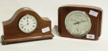 Early twentieth century mantel clock in a domed mahogany case, with enamel dial raised on brass ball