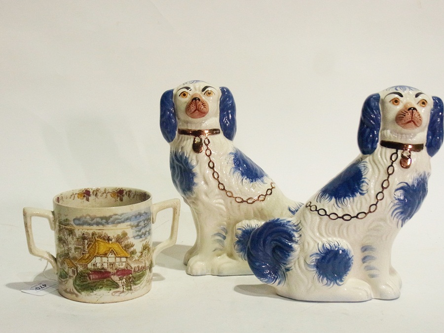 Pair reproduction Staffordshire blue and white pottery spaniels and pottery loving mug