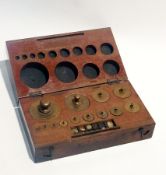 Mahogany cased set of brass weights, stamped 'Oertling', fitted with circular weights from 1000g