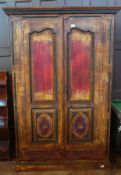 Eastern carved and painted cupboard with ornate carved and painted framed panel doors, two drawers