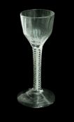 Old English wine glass with ogee bowl and eight wrythen lines from step to lip, the stem with