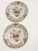 Pair of antique Chinese famille rose plates with stylised peony decoration and similar bordered