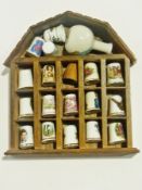 Large quantity of decorative china thimbles and other miniatures