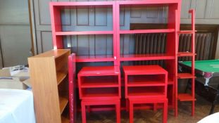 Two Ikea red painted four-tier open shelf units, matching two tier low shelves, two matching tables,