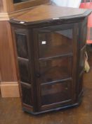 Arts & Crafts style Oliver Morel 1981 hardwood wall-mounted corner cabinet having two shelves