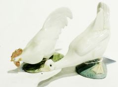 Royal Copenhagen porcelain model of a cockerel pecking from the ground together with a similar Nao