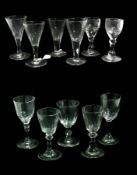 Eleven old English wine glasses, various, with faceted cut bowls, raised on circular foot