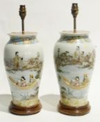 Pair of Japanese porcelain lamp bases, man and woman in boat with figures fishing nearby in garden