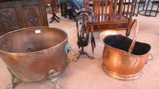 Copper log bucket, oval, on brass paw feet, another copper scuttle and a fireside companion set