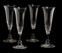 Set of four Georgian ale glasses with trumpet bowl flared rim and facet cut, the collared stem