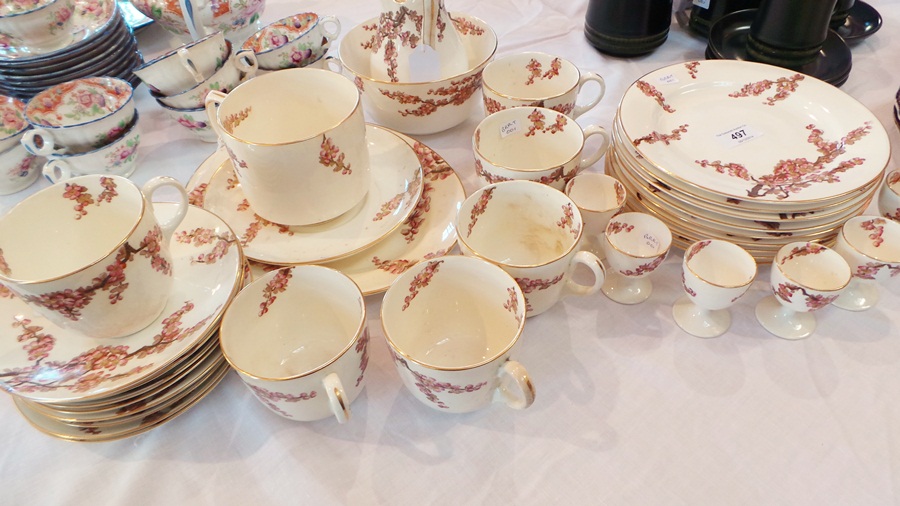 Quantity Crescent china teaware decorated with cherry blossom including cups, saucers and egg cups