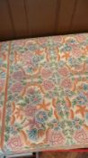 Crewelwork rug, allover stylised rose and flowerhead decorated in shades of pink, green, peach and