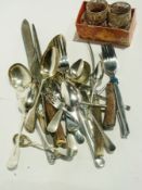 Quantity of flatware including filigree napkin rings with escutcheons, teaspoons, bread knife,
