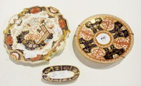 Early 19th century pottery plate with ornate shell and scroll moulded border, decorated in Imari