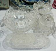 Cut glass fruit bowl, a similar stemmed bowl, jam dish and cover, shallow bowl and two oval