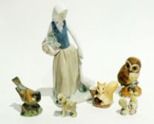 Various china figures including two Wade Disney models, a Hornsea "Fauna" squirrel vase, Royal