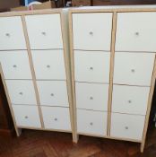 Pair modern chests, each of two rows of four square section drawers, in cream