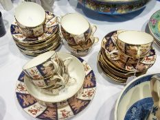 Mintons china teaset decorated in Imari colours, with birds on branches
