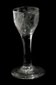 18th century wine glass with ogee bowl, engraved with flower and bird pattern, raised on a