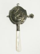 A baby's rattle with mother-of-pearl handle, one bell with two bells missing, inscribed "Jack